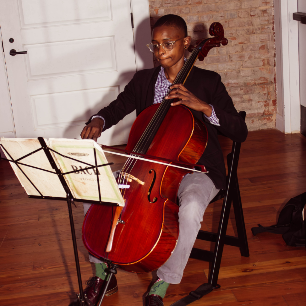 a picture of a person playing the cello.